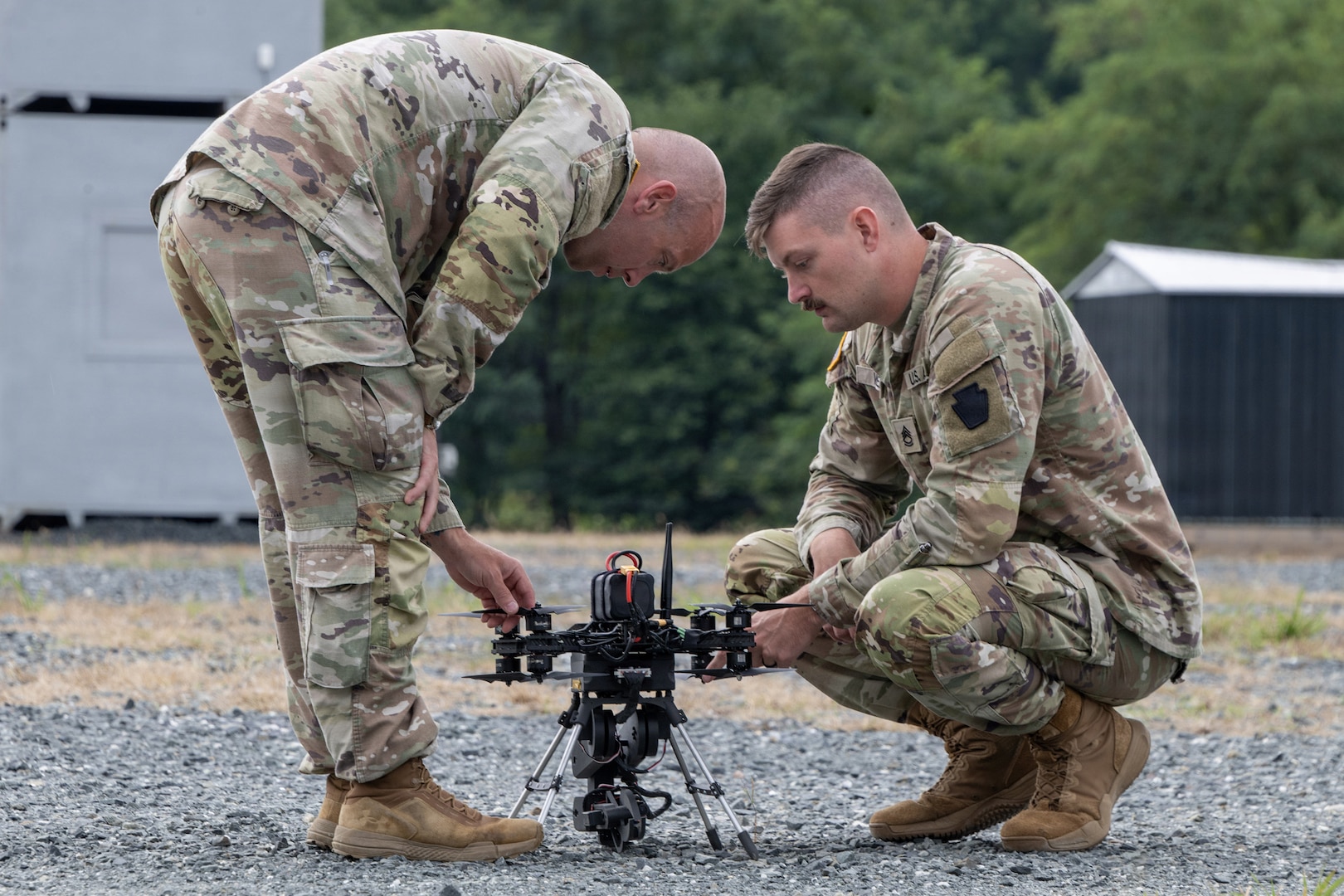Chief Warrant Officer 2 Nathan Shea, left, and Sgt. 1st Class Brent Wehr of the Pennsylvania National Guard’s Unmanned Aircraft System Training and Innovation Facility prepare their Project R.E.D. drone for flight at U.S. Army Combat Capabilities Development Command’s Robotics and Autonomy Showcase Aug. 27, 2026, at Aberdeen Proving Ground, Maryland.
