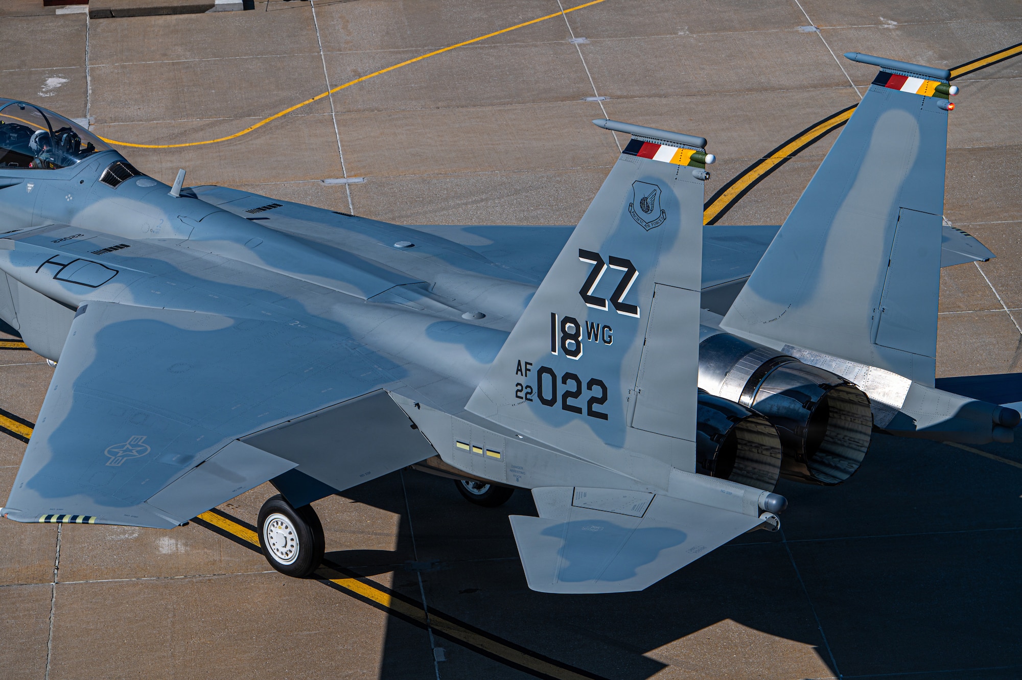 close up of the tail of a jet aircraft as it taxis top down view