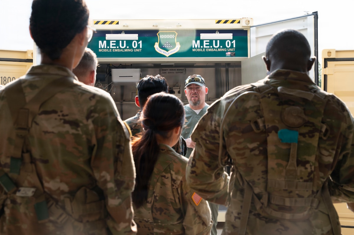 Matthew Metschke, Air Force Mortuary Affairs Operations, Mortuary Affairs Division deputy chief, delivers a brief on the Mobile Embalming Unit (MEU-1) to a group of Exercise Northern Strike 26-2 participants at Grayling Army Airfield, Michigan, Aug. 9, 2026.