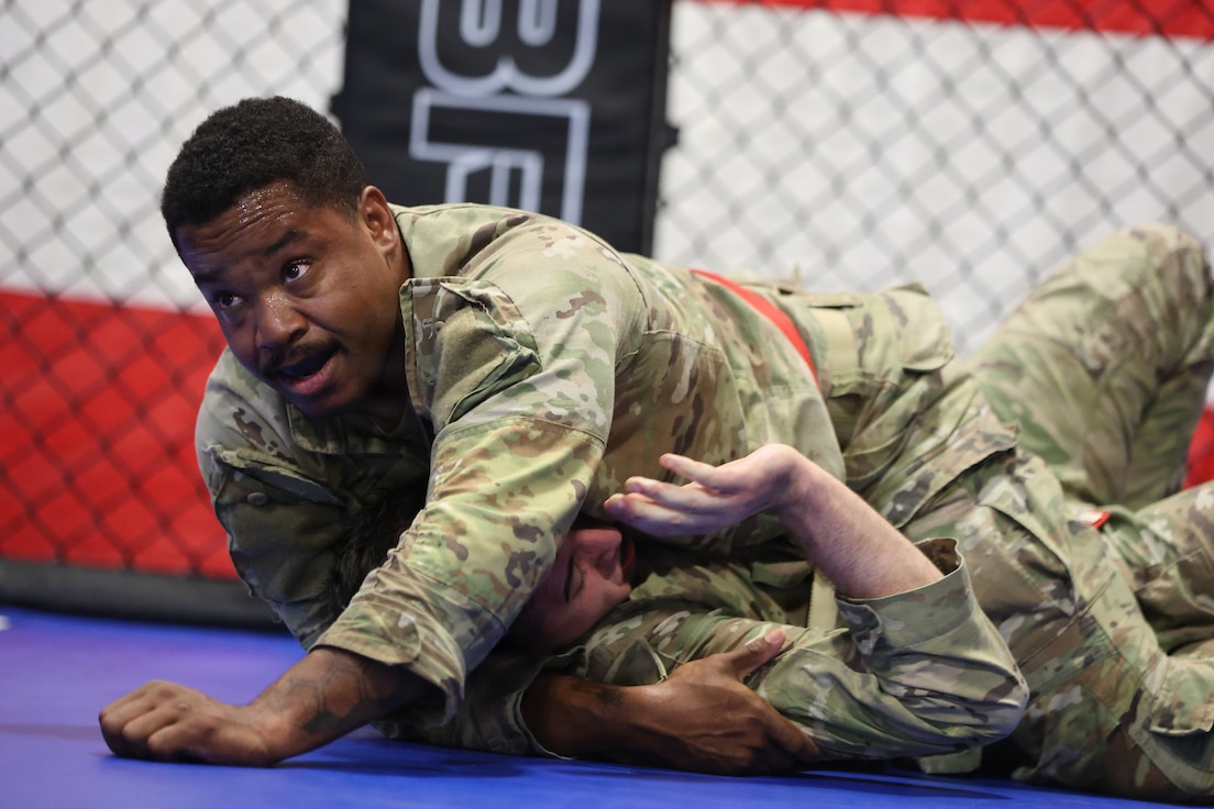 Capt. Jonavan Huggins (top) fights 1st Lt. Jordan Ramirez.