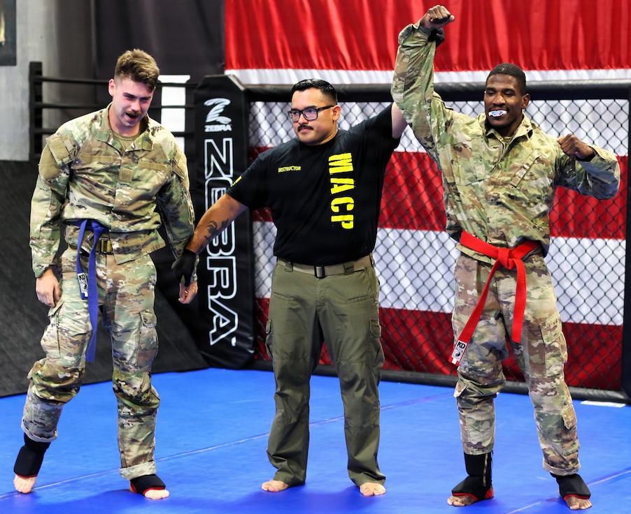 Sgt. Adetunji Jones raises his hand after defeating Sgt. Landon Walker.