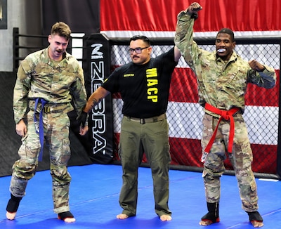 Sgt. Adetunji Jones raises his hand after defeating Sgt. Landon Walker.