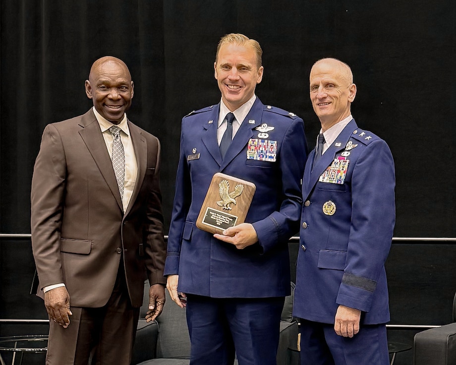 U.S. Air Force Maj. Gen. Randal Efferson, right, U.S. Air National Guard, acting director, and retired Maj. Gen. Ondra Berry, stands with Col. Nick Henschel.