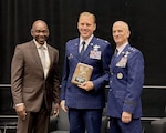 U.S. Air Force Maj. Gen. Randal Efferson, right, U.S. Air National Guard, acting director, and retired Maj. Gen. Ondra Berry, stands with Col. Nick Henschel, 126th Air Refueling Wing, commander, after winning the The Curtis N. 