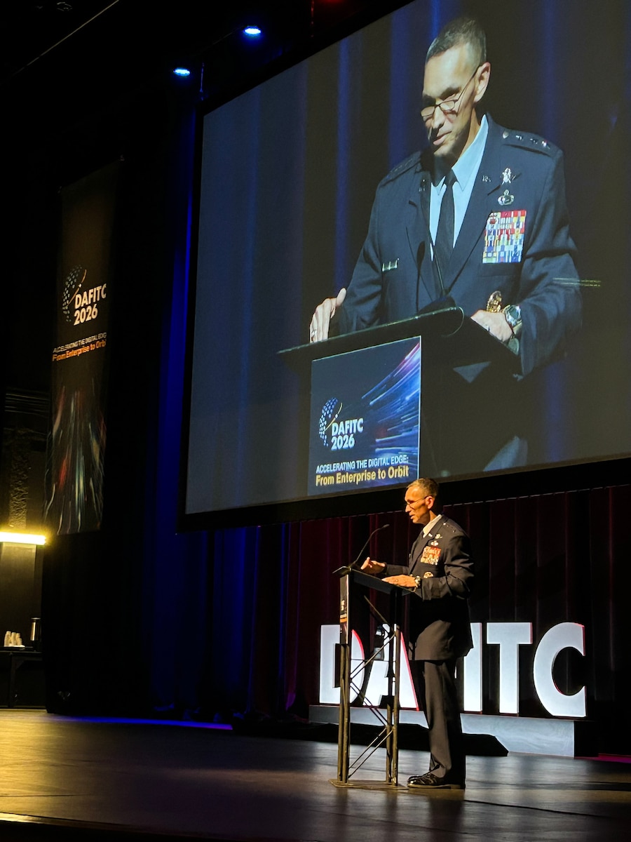 The commander of 16th Air Force (Air Forces Cyber), Lt. Gen. Thomas Hensley, delivers a keynote address during the Department of the Air Force Information Technology and Cyber conference in Montgomery, Alabama, on Aug. 26, 2024. During his address, Hensley explained the command’s forward-leaning strategy to outpace autonomous AI threats at machine speed, hardening military networks and safeguarding critical defense infrastructure.