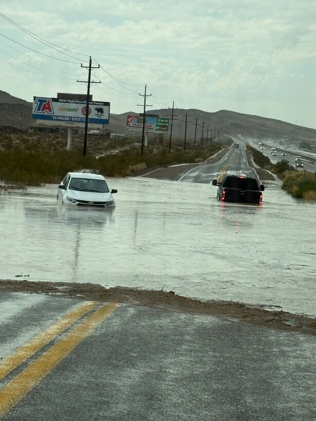 Marine Corps Logistics Base Barstow Fire and Emergency Services personnel responded to a reported swift-water rescue in the Yermo, California area, August 11, 2026, successfully rescuing two people from a partially submerged vehicle despite challenging flood conditions and degraded communications.