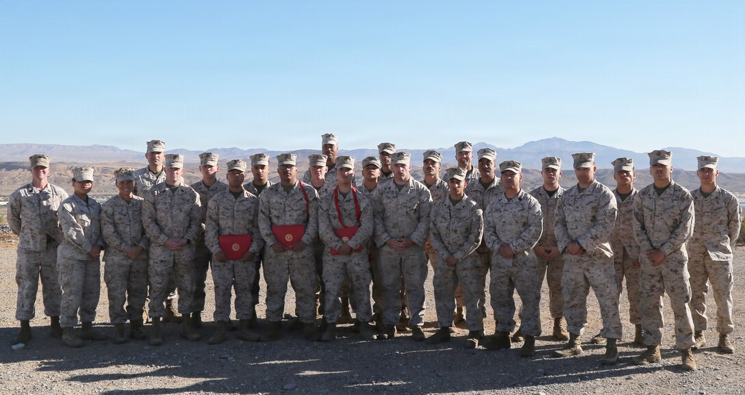 U.S. Marines with Headquarters Company, stand in formation during a meritorious promotion ceremony aboard Marine Corps Logistics Base (MCLB)  - Barstow, September 2. Private First-Class Justinelou Pascual was meritoriously promoted to the rank of lance corporal, while Lance Corporals Gael Espinosa and Fredrick Sualau were meritoriously promoted to the rank of corporal. The ceremony recognized the Marines for their sustained superior performance, leadership, and outstanding contributions to the command. (U.S. Marine Corps photos by Anthony Plummer