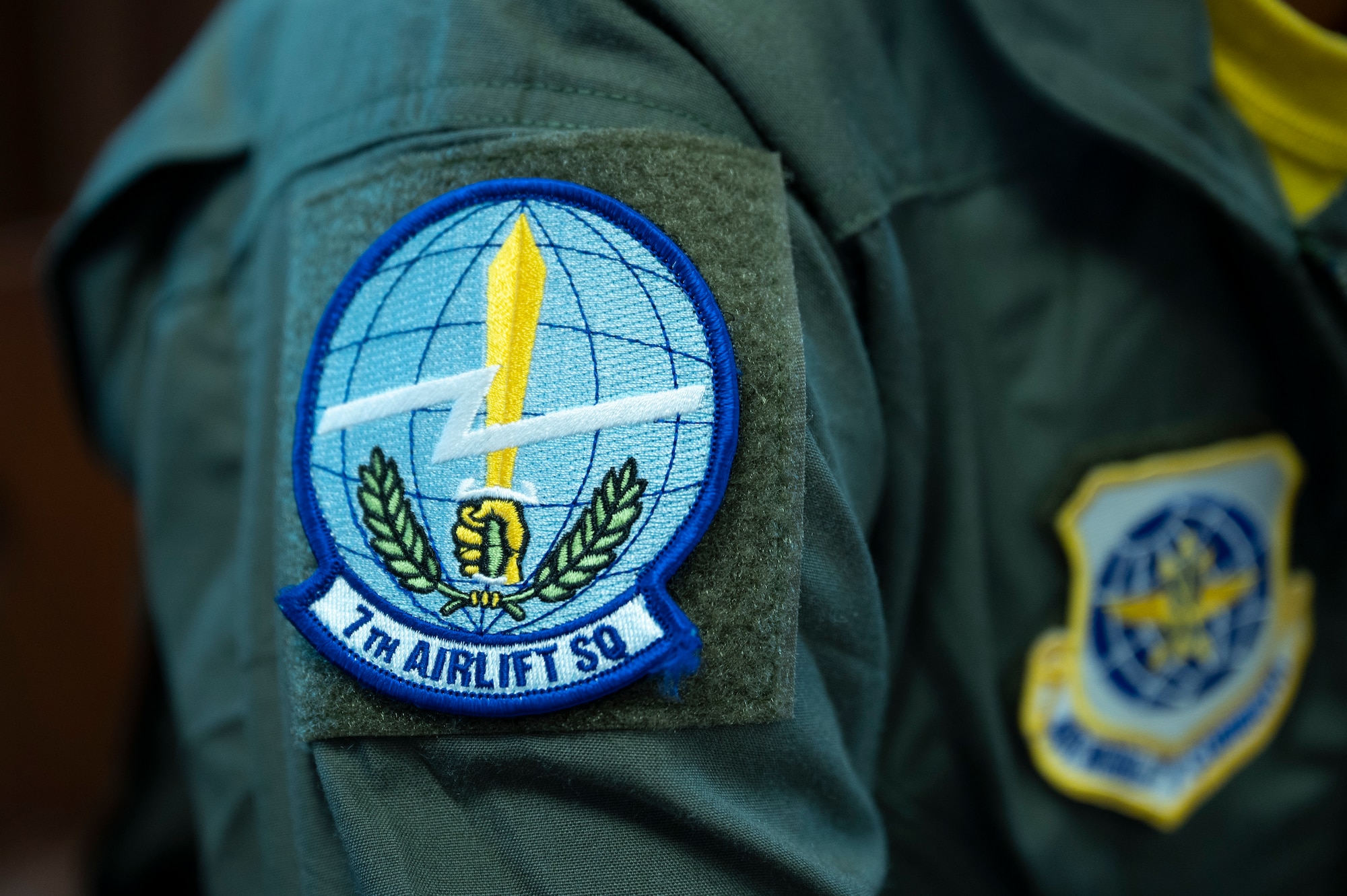 A photo of a squadron patch on someone's arm.