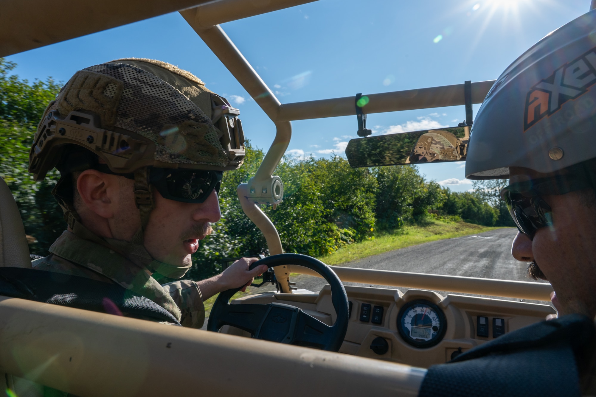 U.S. Air Force Airman 1st Class Zared Speicher, a 673d Security Forces Squadron defender, drives an all-terrain vehicle while receiving instruction from Staff Sgt. Nevin Larock, an instructor with the 673d SFS, during Alaska Defense Sustainment Training at Joint Base Elmendorf-Richardson, Alaska, Aug. 31, 2026.