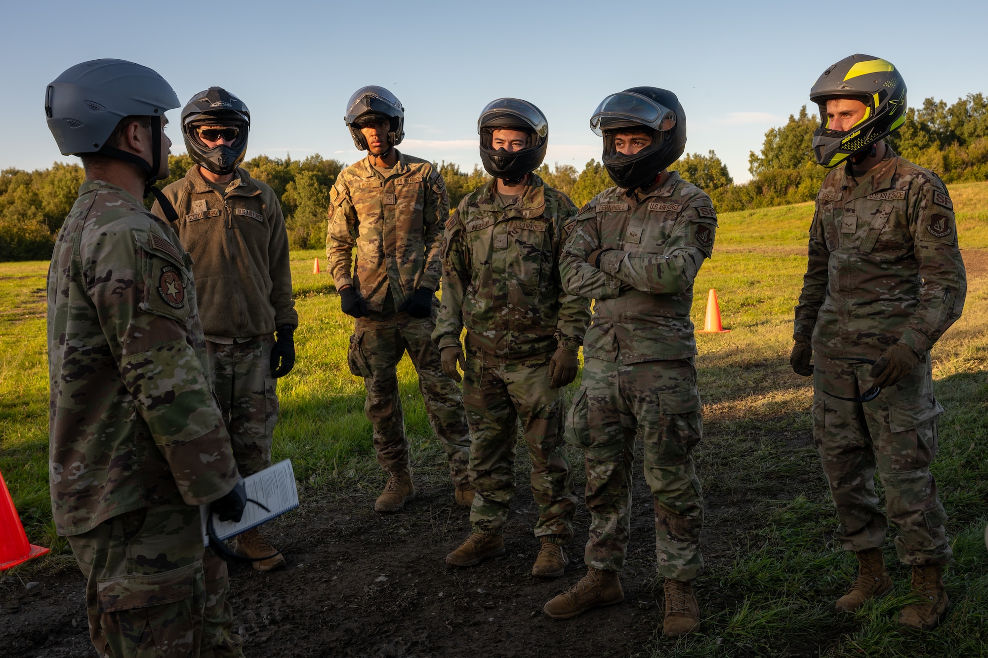 U.S. Air Force Staff Sgt. Nevin Larock, an instructor with the 673d Security Forces Squadron, briefs participants on vehicle safety procedures prior to an all-terrain vehicle ride during Alaska Defense Sustainment Training at Joint Base Elmendorf-Richardson, Alaska, Aug. 31, 2026.