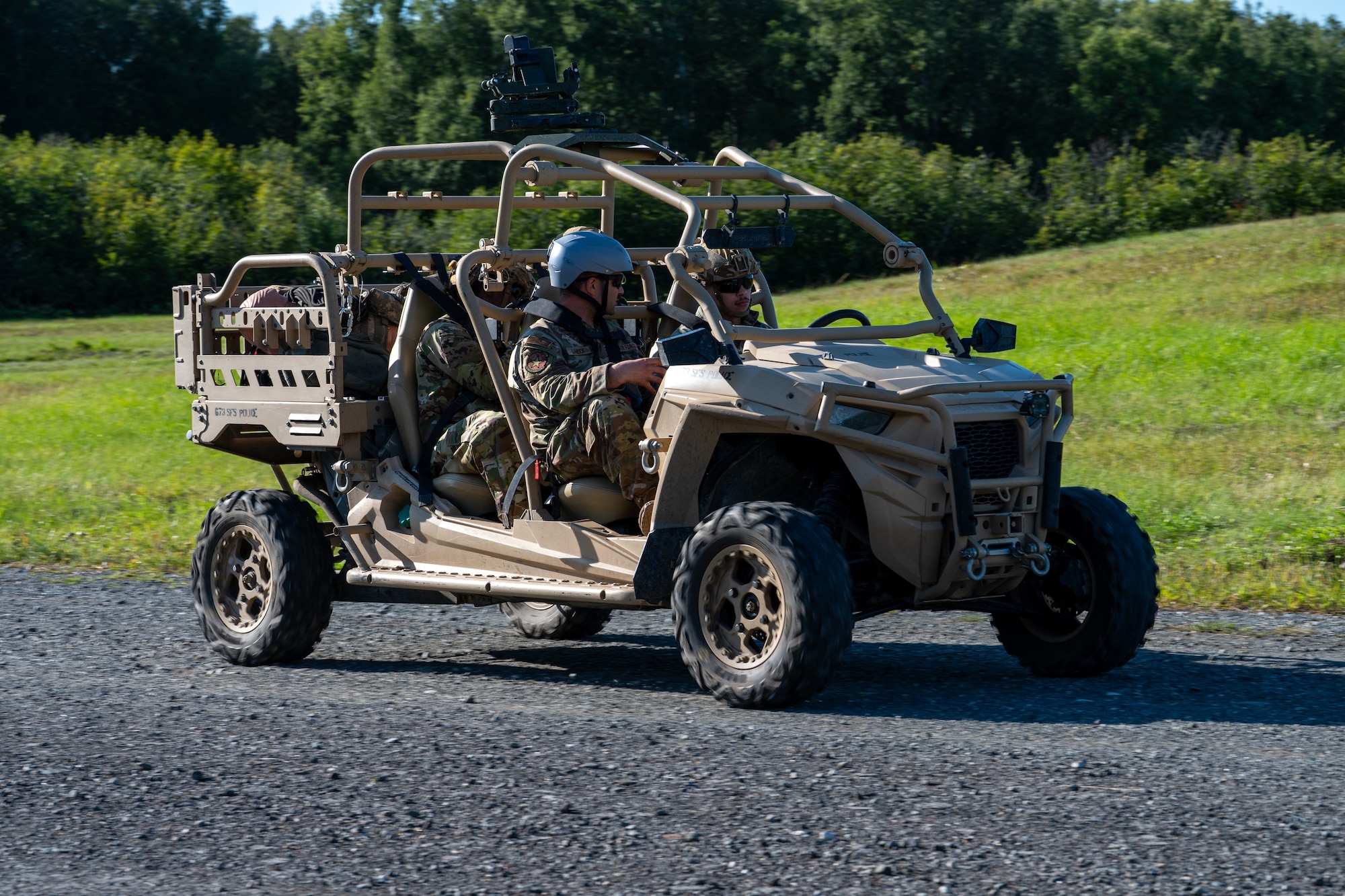 U.S. Air Force Airman 1st Class Adam Fernandez, a 673d Security Forces Squadron defender, drives an all-terrain vehicle while receiving instruction from Staff Sgt. Nevin Larock, an instructor with the 673d SFS, during Alaska Defense Sustainment Training at Joint Base Elmendorf-Richardson, Alaska, Aug. 31, 2026.