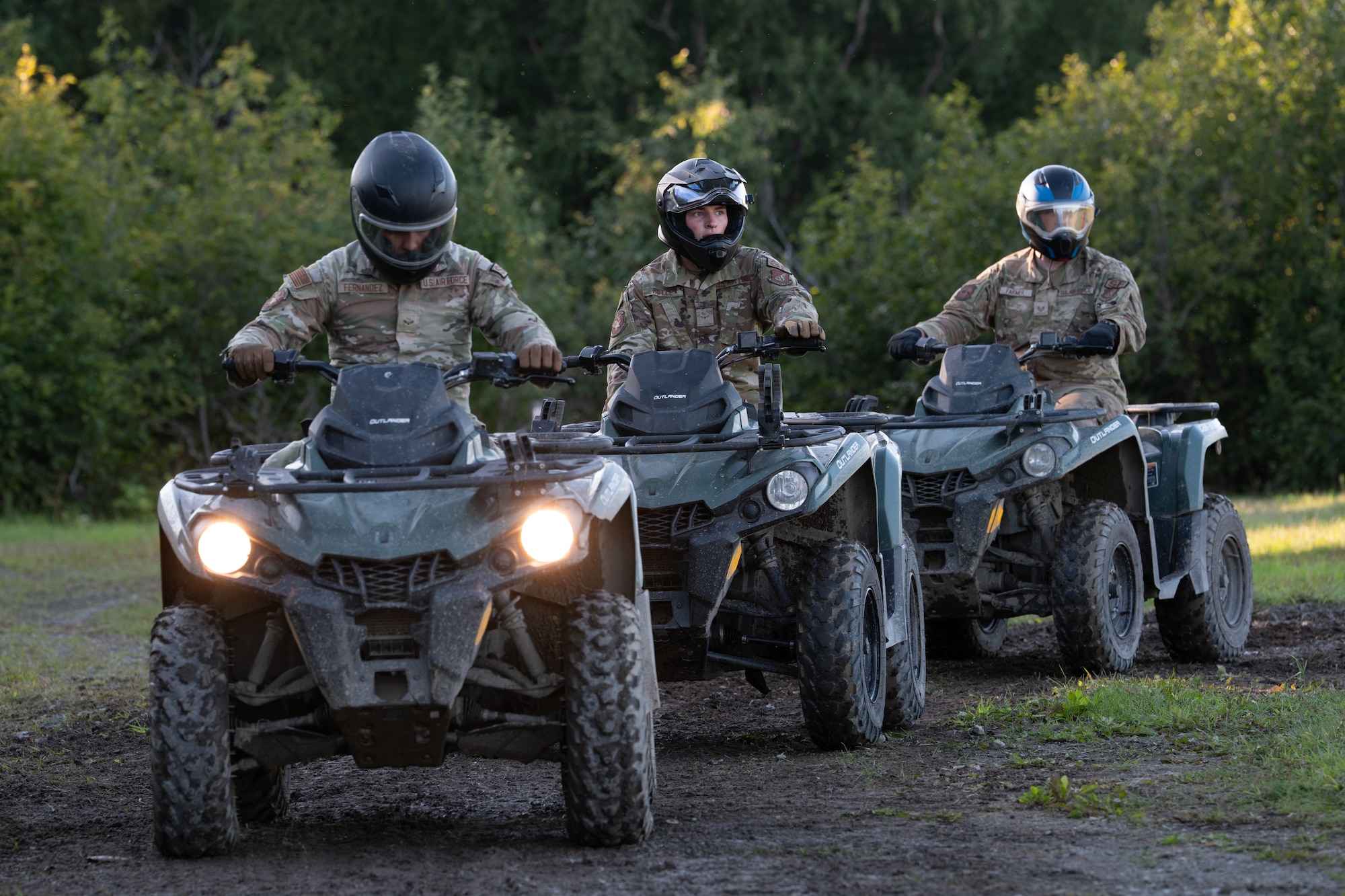 From left, U.S. Air Force Airman 1st Class Adam Fernandez, Airman Levi Ruyle, and Staff Sgt. Ethan Farmer, 673d Security Forces Squadron defenders, ride all-terrain vehicles during Alaska Defense Sustainment Training at Joint Base Elmendorf-Richardson, Alaska, Aug. 31, 2026.