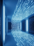 Radiant streams of information highlighted by rhythmic blue particles. Glowing data stream corridor with flowing bits and overhead light particles, immersive tunnel of code and reflections.