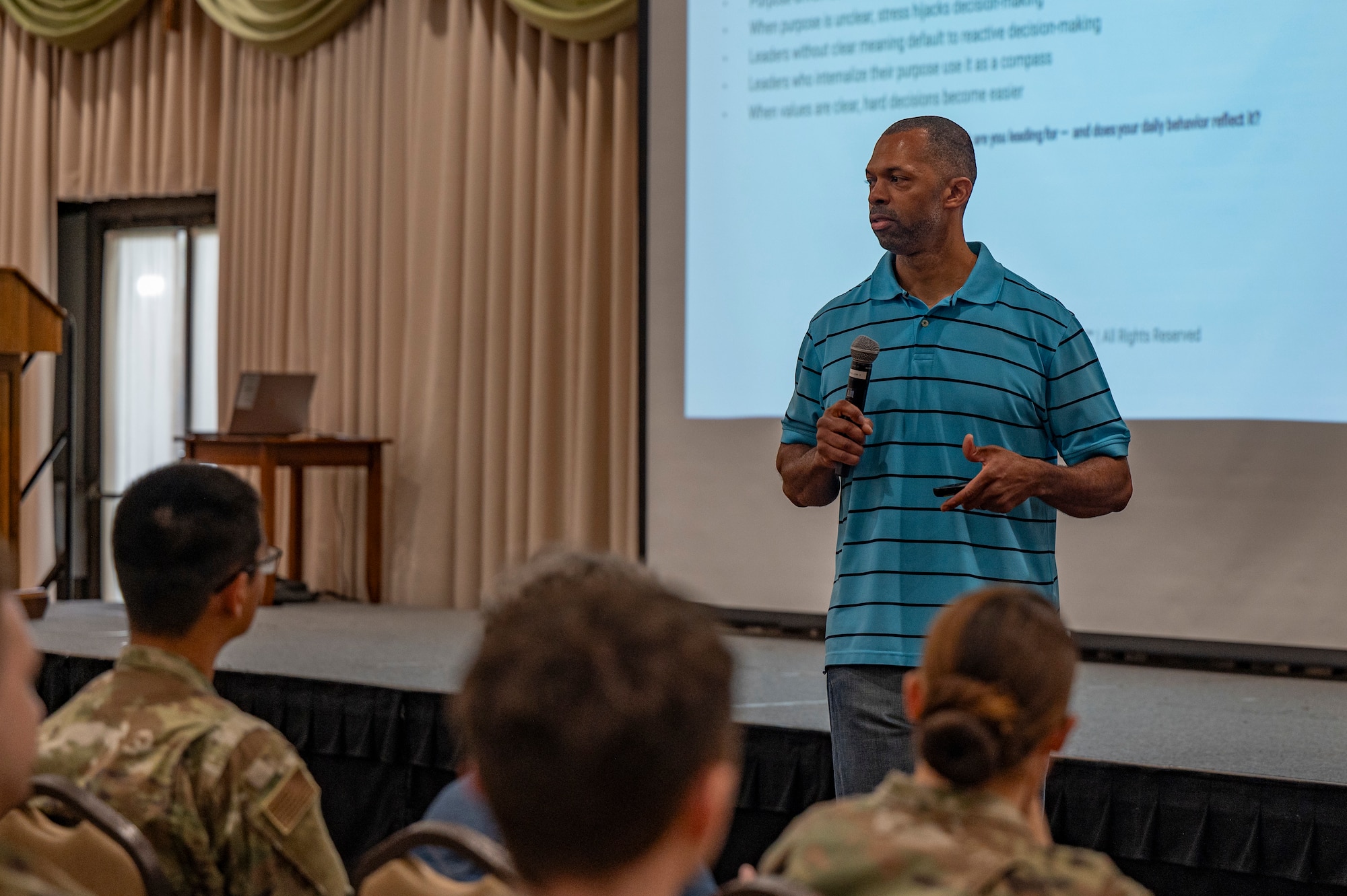 U.S. Air Force Senior Master Sgt. Adam Hodges, 7th Equipment Maintenance Squadron fabrication flight chief, delivers a speech on how to treat resiliency as a trainable characteristic during Comprehensive Fitness Day at Joint Base McGuire-Dix-Lakehurst, N.J., Aug. 28, 2026.