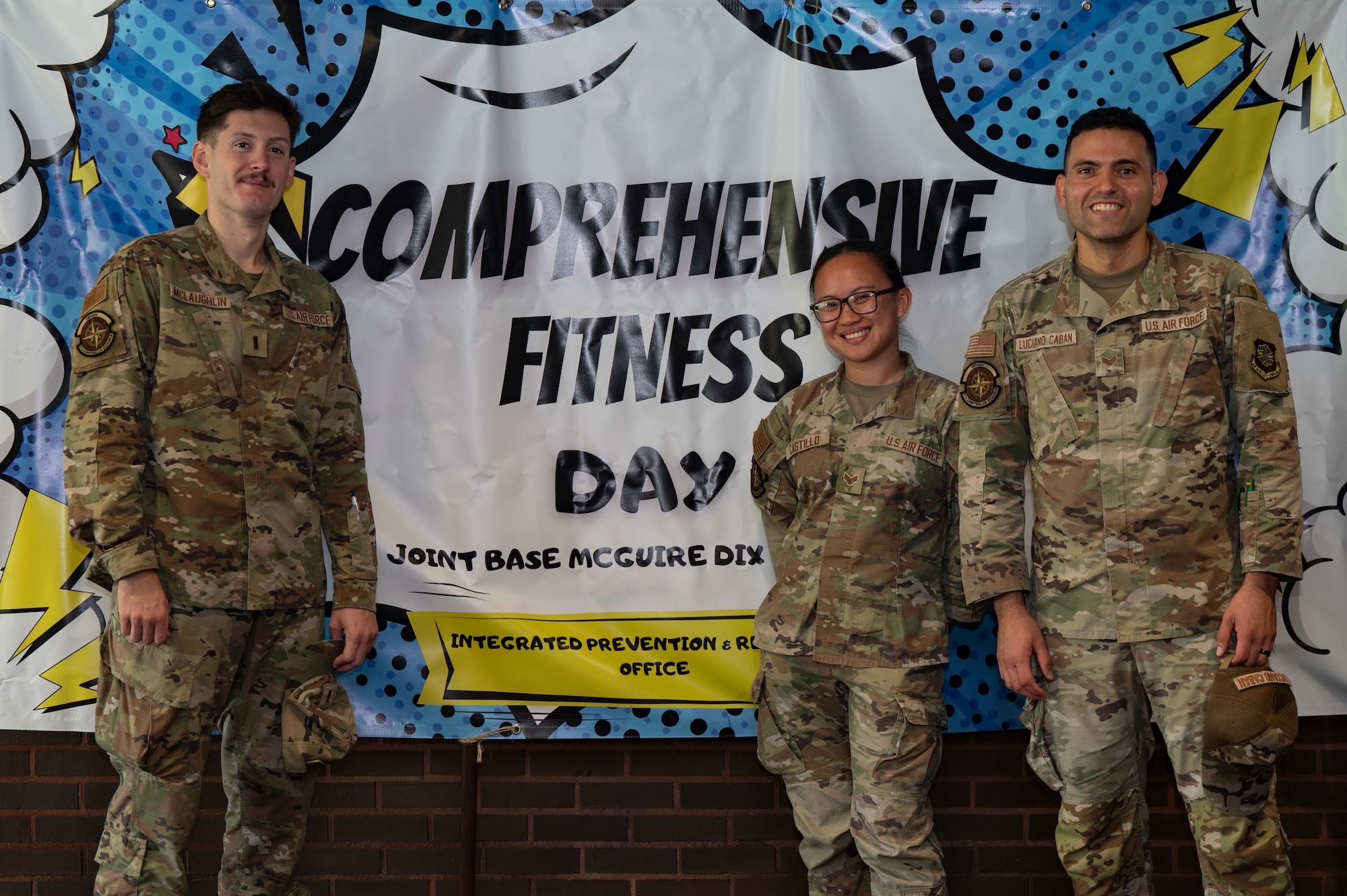 U.S. Air Force 2nd Lt. Ryan McLaughlin, 87th Comptroller Squadron financial operations deputy flight commander, left, Senior Airman Aisha Marie Castillo, 87th CPTS financial management technician, center, and Senior Airman Gabriel Luciano Caban, 87th CPTS financial management technician, pose for a group photo during Comprehensive Fitness Day at Joint Base McGuire-Dix-Lakehurst, N.J., Aug. 28, 2026