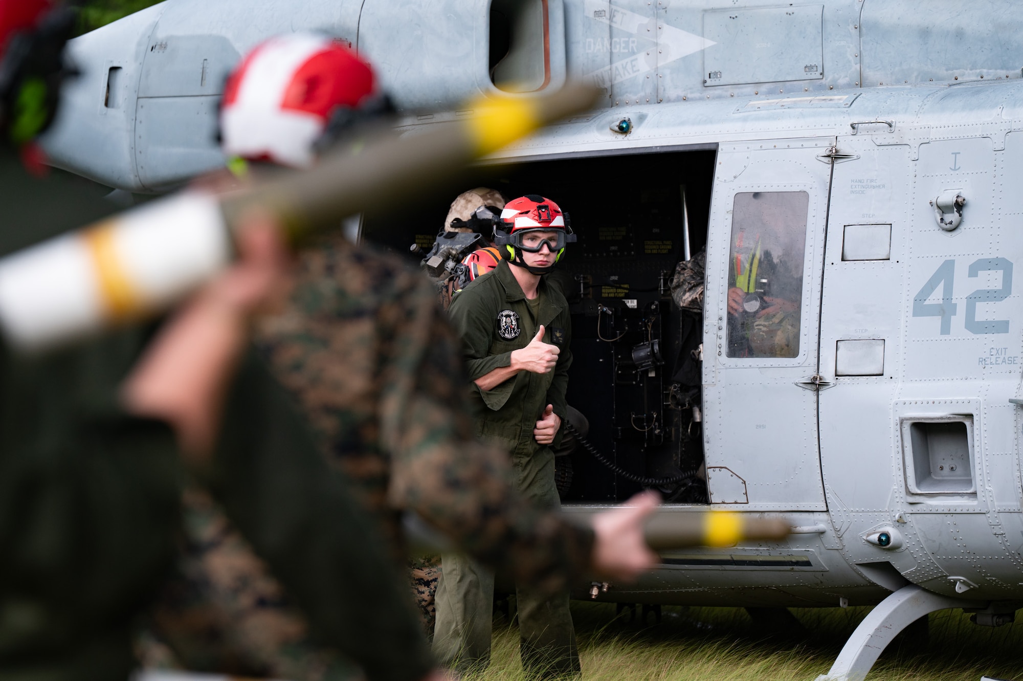 U.S. Marine Corps Lance Cpl. Frank Stanton, Marine Aviation Logistics Squadron (MALS) 49 aviation ordnance technician, finishes loading a high-explosive rocket into a UH-1Y Venom helicopter assigned to Marine Light Attack Helicopter Squadron (HMLA) 773 at Joint Base McGuire-Dix-Lakehurst, N.J., Aug. 27, 2026. Marines executed a forward arming and refueling point exercise to prepare personnel to rapidly arm aircraft in support of expeditionary aviation operations. (U.S. Air Force photo by Airman 1st Class Haeleigh Bayle)