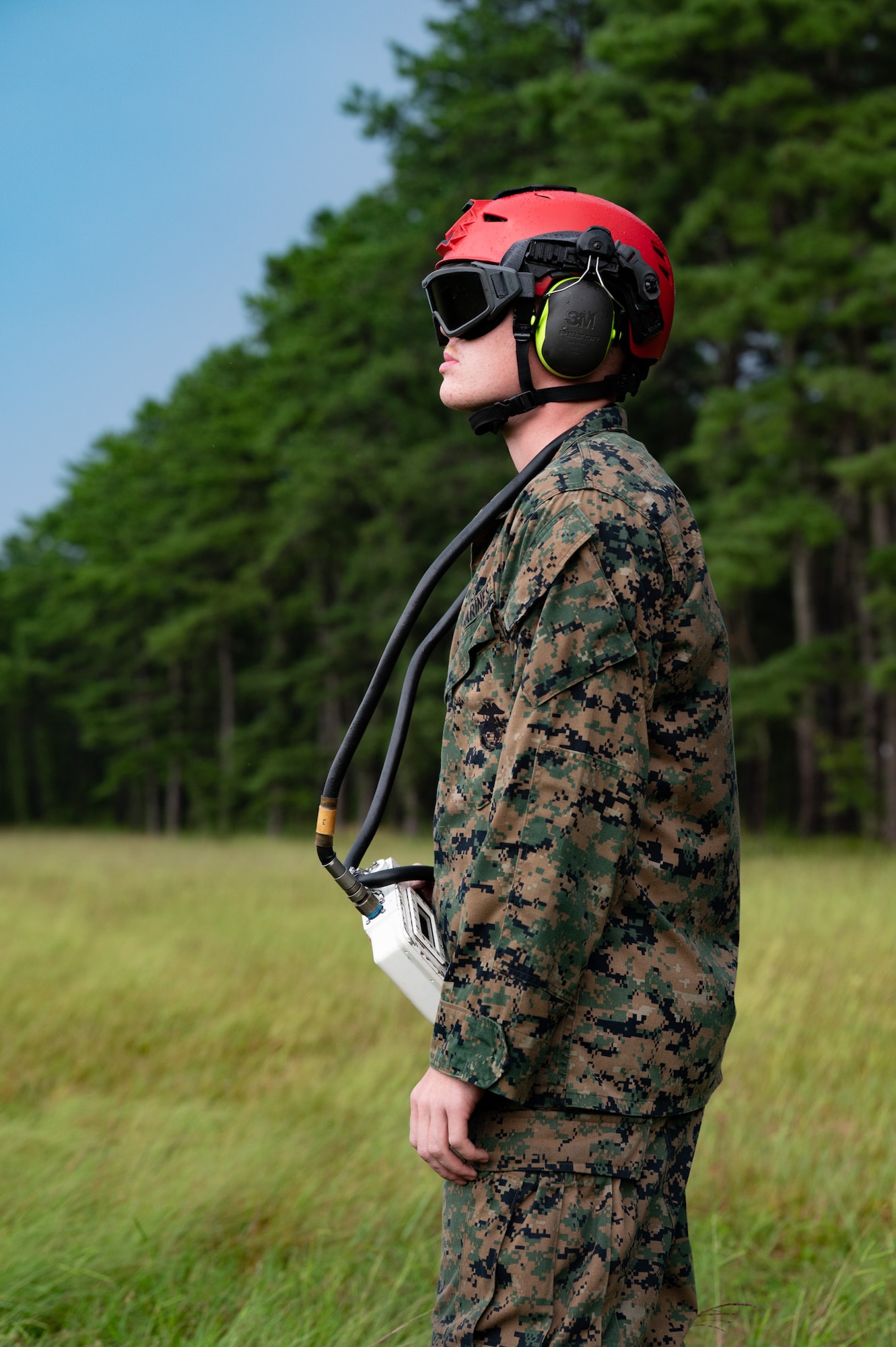 U.S. Marine Corps Lance Cpl. Declan Oregan, Marine Light Attack Helicopter Squadron (HMLA) 773 aviation ordnance technician, stands ready during a forward arming and refueling point exercise at Joint Base McGuire-Dix-Lakehurst, N.J., Aug. 27, 2026. Marines worked to safely load, de-arm and unload weapons and ammunition, all while practicing quick turnarounds for efficiency. (U.S. Air Force photo by Airman 1st Class Haeleigh Bayle)