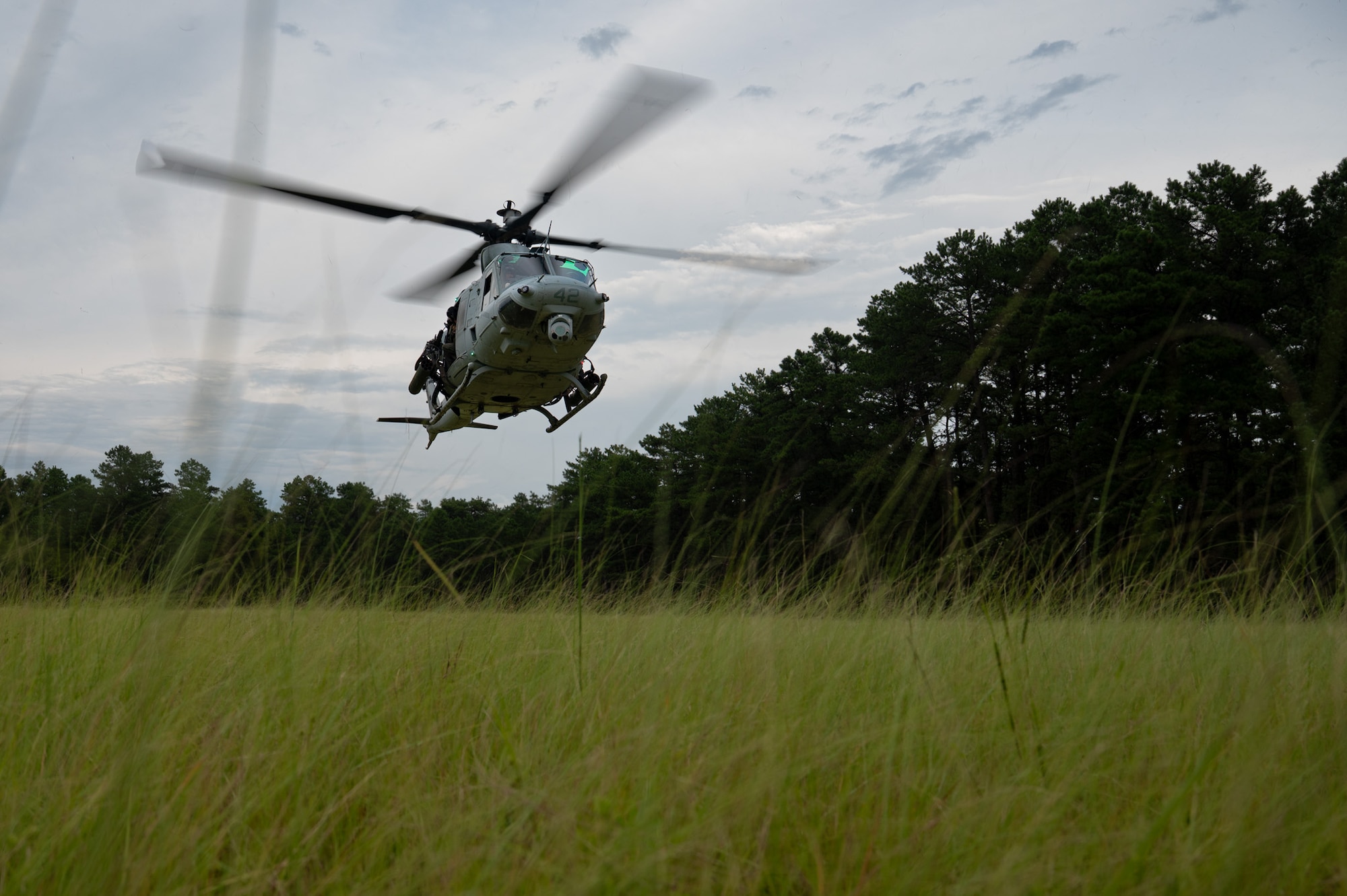 A U.S. Marine Corps UH-1Y Venom helicopter, assigned to Marine Light Attack Helicopter Squadron (HMLA) 773, prepares to land during a forward arming and refueling point training at Joint Base McGuire-Dix-Lakehurst, N.J., Aug. 27, 2026. The training tested the Marine’s ability to quickly supply ordnance to helicopters in a simulated combat zone. (U.S. Air Force photo by Airman 1st Class Haeleigh Bayle)
