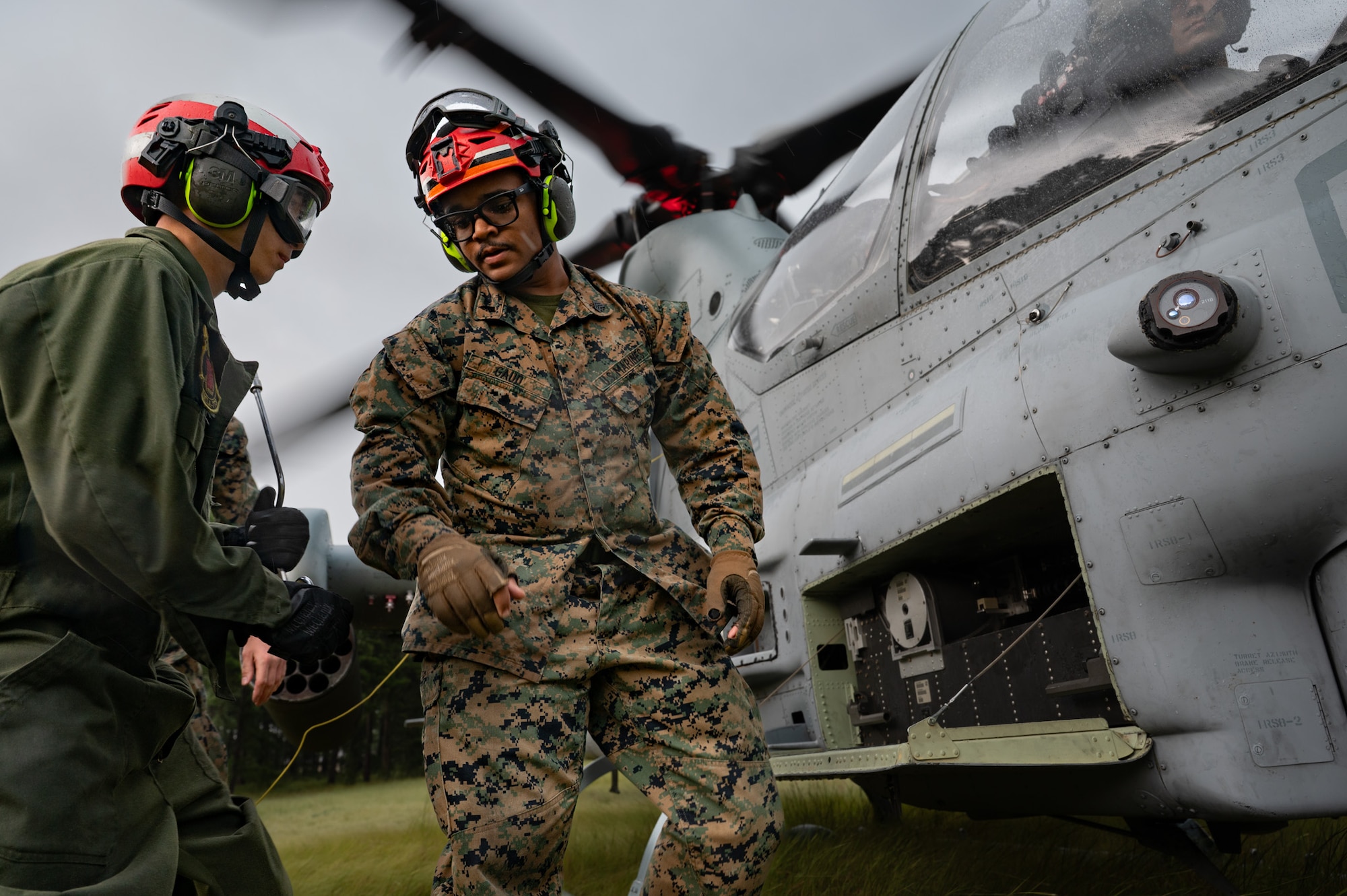 U.S. Marine Corps Pfc. Colton Sams, left, and Sgt. Carltin Gaud, right, Marine Light Attack Helicopter Squadron (HMLA) 773 aviation ordnance technicians, prepare an AH-1Z Viper helicopter, assigned to HMLA-773, during a forward arming and refueling point exercise at Joint Base McGuire-Dix-Lakehurst, N.J., Aug. 27, 2026. Readiness exercises ensure personnel are equipped with the skills and knowledge needed to successfully complete missions in training operations and combat zones. (U.S. Air Force photo by Airman 1st Class Haeleigh Bayle)