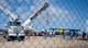 Missile maintenance technicians assigned to the 583rd Missile Maintenance Squadron prepare to lift a missile suspension system with a crane at a launch facility near Minot Air Force Base, North Dakota, Aug. 18, 2026.