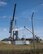 Missile maintenance technicians with the 583rd Missile Maintenance Squadron lower a missile suspension system into a silo at a launch facility near Minot Air Force Base, North Dakota, Aug. 18, 2026.