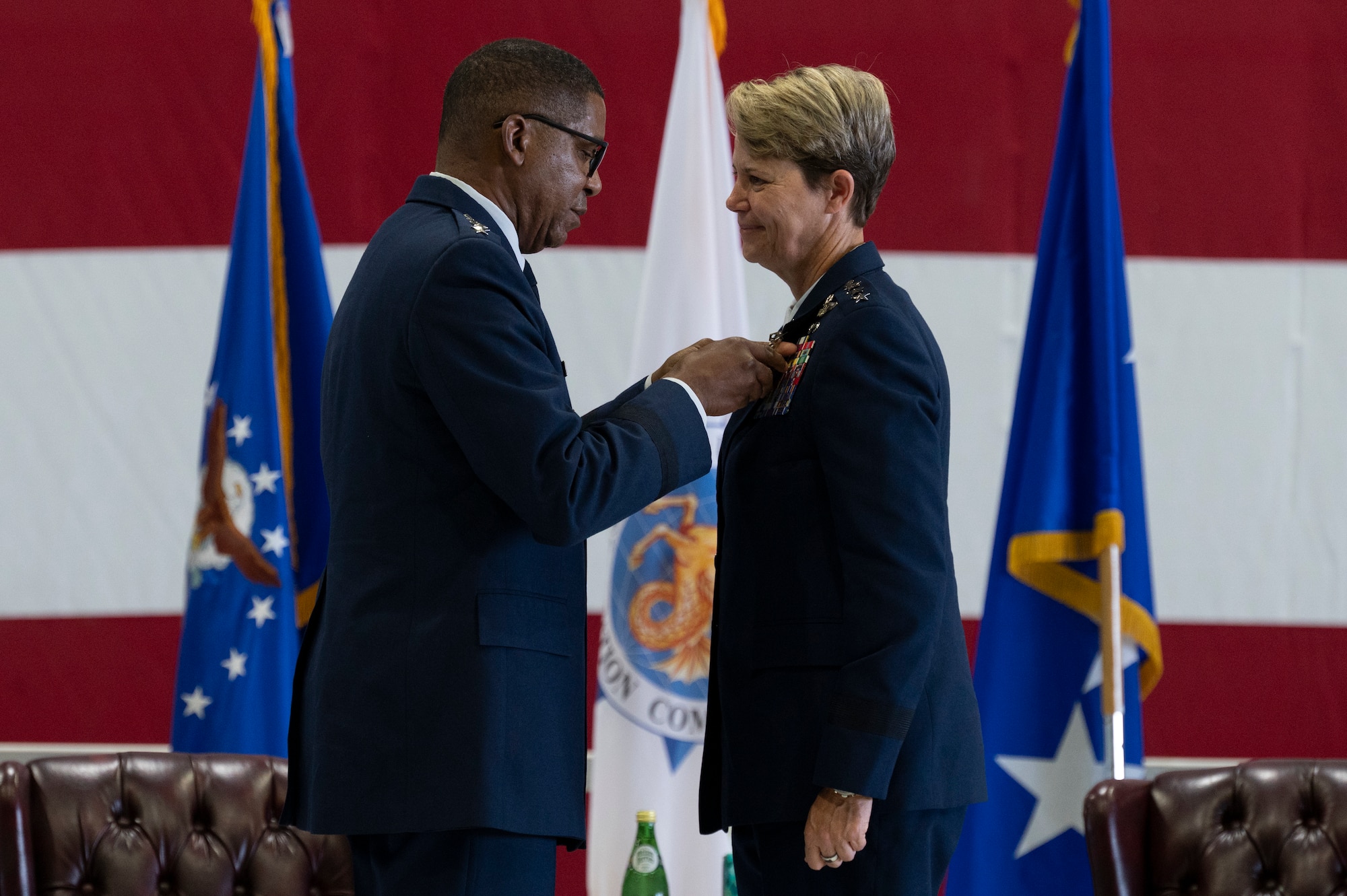 U.S. Air Force Gen. Randall Reed, commander of U.S. Transportation Command, pins the Air Force Distinguished Service Medal on Lt. Gen. Rebecca Sonkiss, Air Mobility Command deputy commander, during her retirement ceremony on Scott Air Force Base, Illinois, September 3, 2026. Members across the mobility enterprise, family, and distinguished guests gathered to honor Sonkiss’s strategic contributions to joint warfighting readiness and her advocacy for Airmen through 32 years of distinguished military service. (U.S. Air Force photo by Tech. Sgt. Dalton Williams)