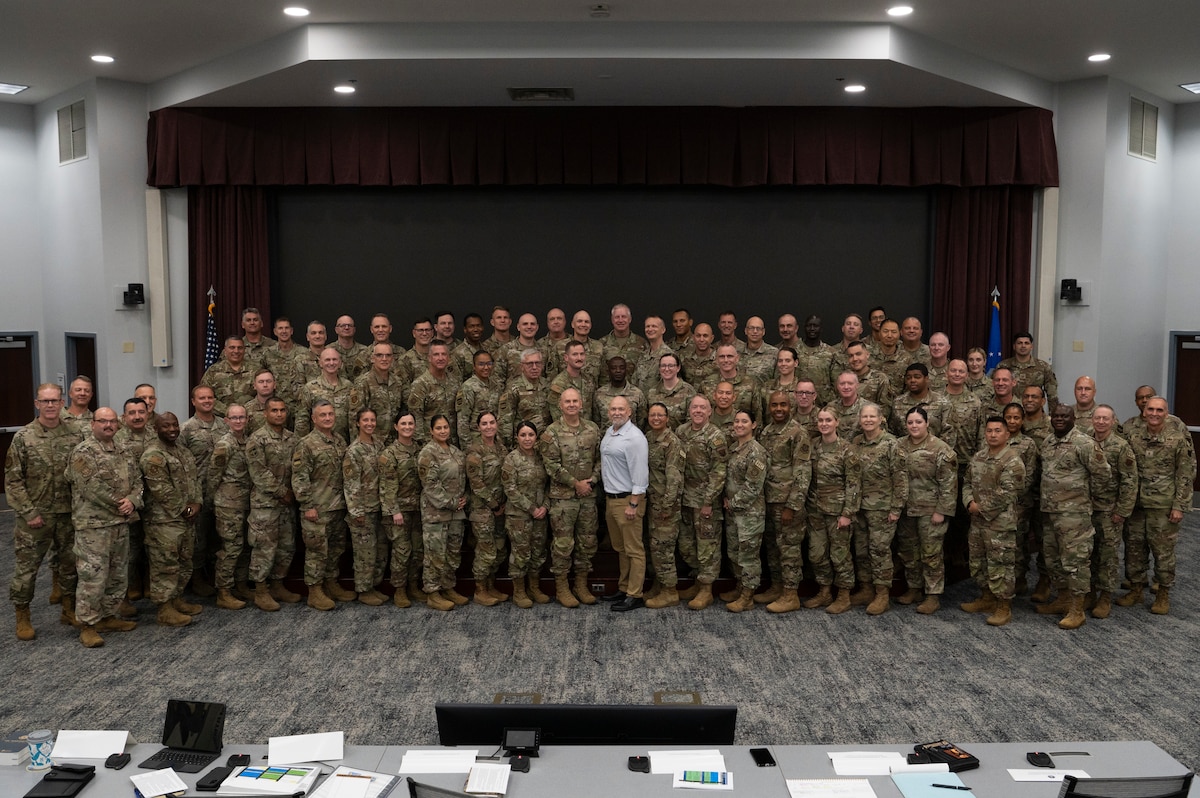 Airmen stand for a photo