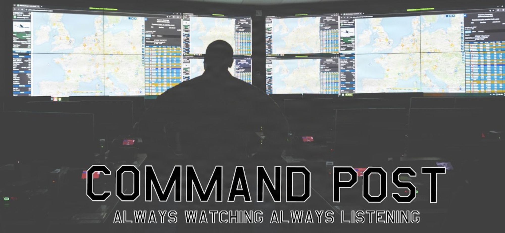 An Airman sits in a room filled with monitors. (U.S. Air Force graphic by Senior Airman Olivia Bithell)