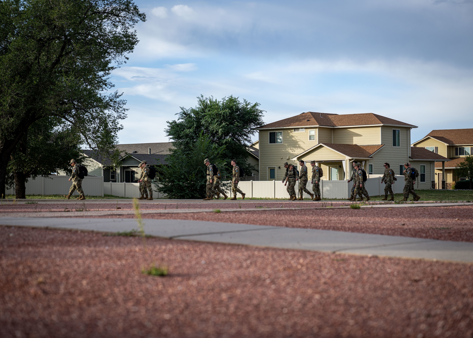 Military members complete a ruck march on Peterson Space Force Base.