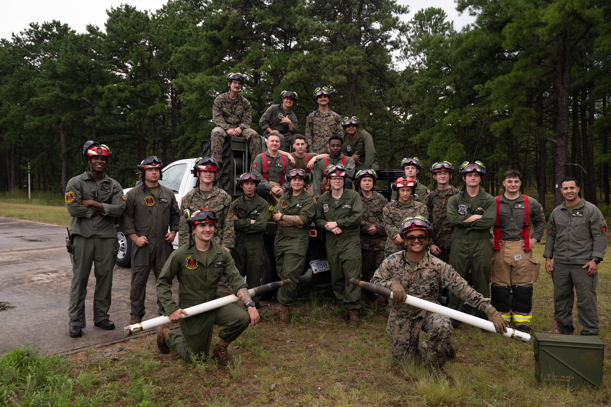 U.S. Marines assigned to Marine Light Attack Helicopter Squadron (HMLA) 773, Marine Aviation and Logistics Squadron (MALS) 49 and Marine Wing Support Squadron (MWSS) 472 pose for a group photo after completing a forward arming and refueling point exercise at Joint Base McGuire-Dix-Lakehurst, N.J., Aug. 27, 2026.