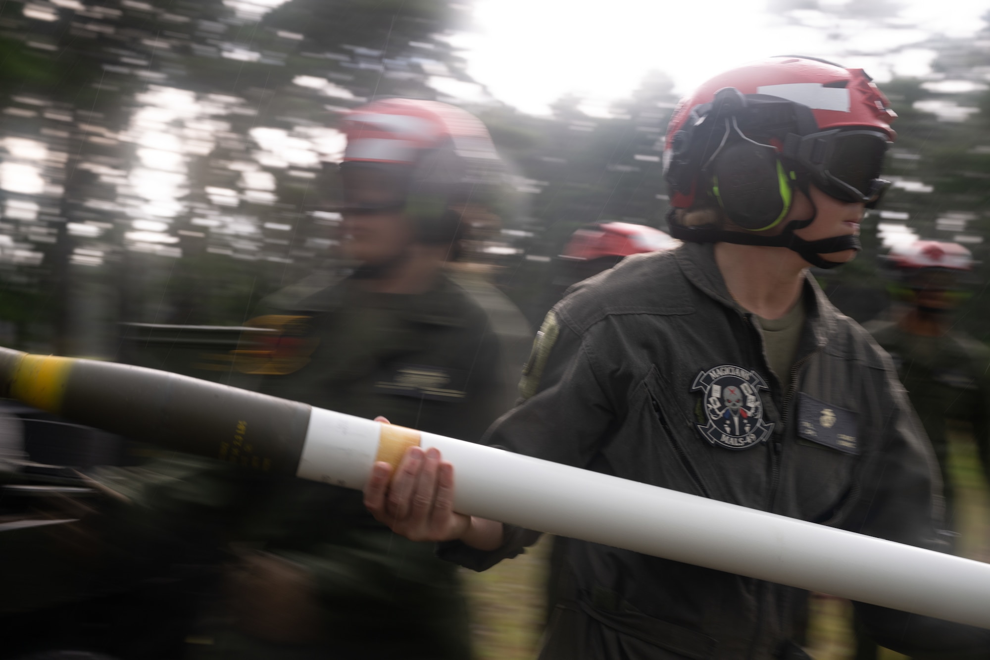 A U.S. Marine assigned to the Marine Aviation and Logistics Squadron (MALS) 49 carries a high-explosive rocket to an AH-1Z Viper helicopter during a forward arming and refueling point exercise at Joint Base McGuire-Dix-Lakehurst, N.J., Aug. 27, 2026.
