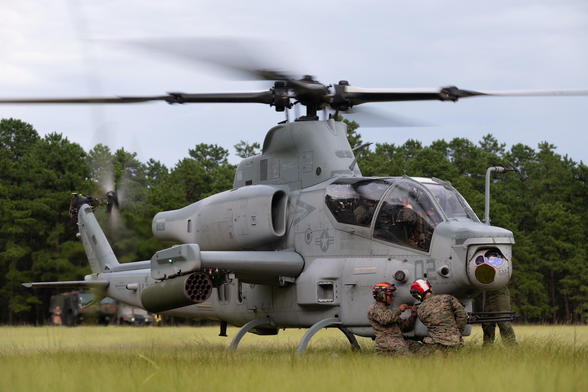 U.S. Marines assigned to Marine Light Attack Helicopter Squadron (HMLA) 773 arm an AH-1Z Viper helicopter during a forward arming and refueling point exercise at Joint Base McGuire-Dix-Lakehurst, N.J., Aug. 27, 2026.