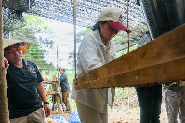 Members of Defense POW/MIA Accounting Agency Recovery Team 1 and local Vietnamese workers conduct excavation operations alongside U.S. Ambassador to Vietnam Jennifer Wicks