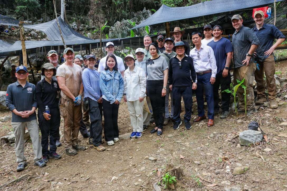 Members of Defense POW/MIA Accounting Agency Recovery Team 1 and local Vietnamese workers pose for a photo alongside U.S. Ambassador to Vietnam Jennifer Wicks