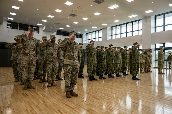 CAMP ASAKA, JAPAN - U.S. Soldiers render a hand-salute while standing in formation with Japanese Ground Self-Defense Forces (JGSDF) Soldiers and Australian Army Soldiers at the opening ceremony for Exercise Yama Sakura 91, Sept. 2, 2026. YS 91 is an annual multilateral CPX hosted by Japan Ground Self Defense Force and conducted in multiple locations throughout Japan. YS 91 is designed to enhance U.S., Japan and multinational partner combat readiness and interoperability while strengthening multinational relationships and demonstrating U.S. resolve to support the security interests of friends and allies in the region. (U.S. Navy photo by Mass Communication Specialist 2nd Class Christian Kibler)
