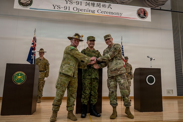 CAMP ASAKA, JAPAN - U.S. Army Lt. Gen. Matthew McFarlane, commanding general of I Corps, right, shakes hands with Japan Ground Self Defense Force (JGSDF) Lt. Gen. Makoto Endo, center, commanding general, Japanese Ground Component Command, and Australian Army Maj. Gen. Ash Collinburn, Commander, 1st Australian Division, at the opening ceremony for Exercise Yama Sakura 91, Sept. 2, 2026. YS 91 is an annual multilateral CPX hosted by Japan Ground Self Defense Force (JGSDF) and conducted in multiple locations throughout Japan. YS 91 is designed to enhance U.S., Japan and multinational partner combat readiness and interoperability while strengthening multinational relationships and demonstrating U.S. resolve to support the security interests of friends and allies in the region. (U.S. Navy photo by Mass Communication Specialist 2nd Class Christian Kibler)
