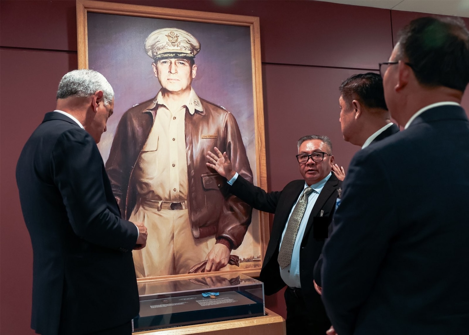 Kelly McKeague, Defense POW/MIA Accounting Agency director, gives a tour of the Pentagon to members of the Lao delegation