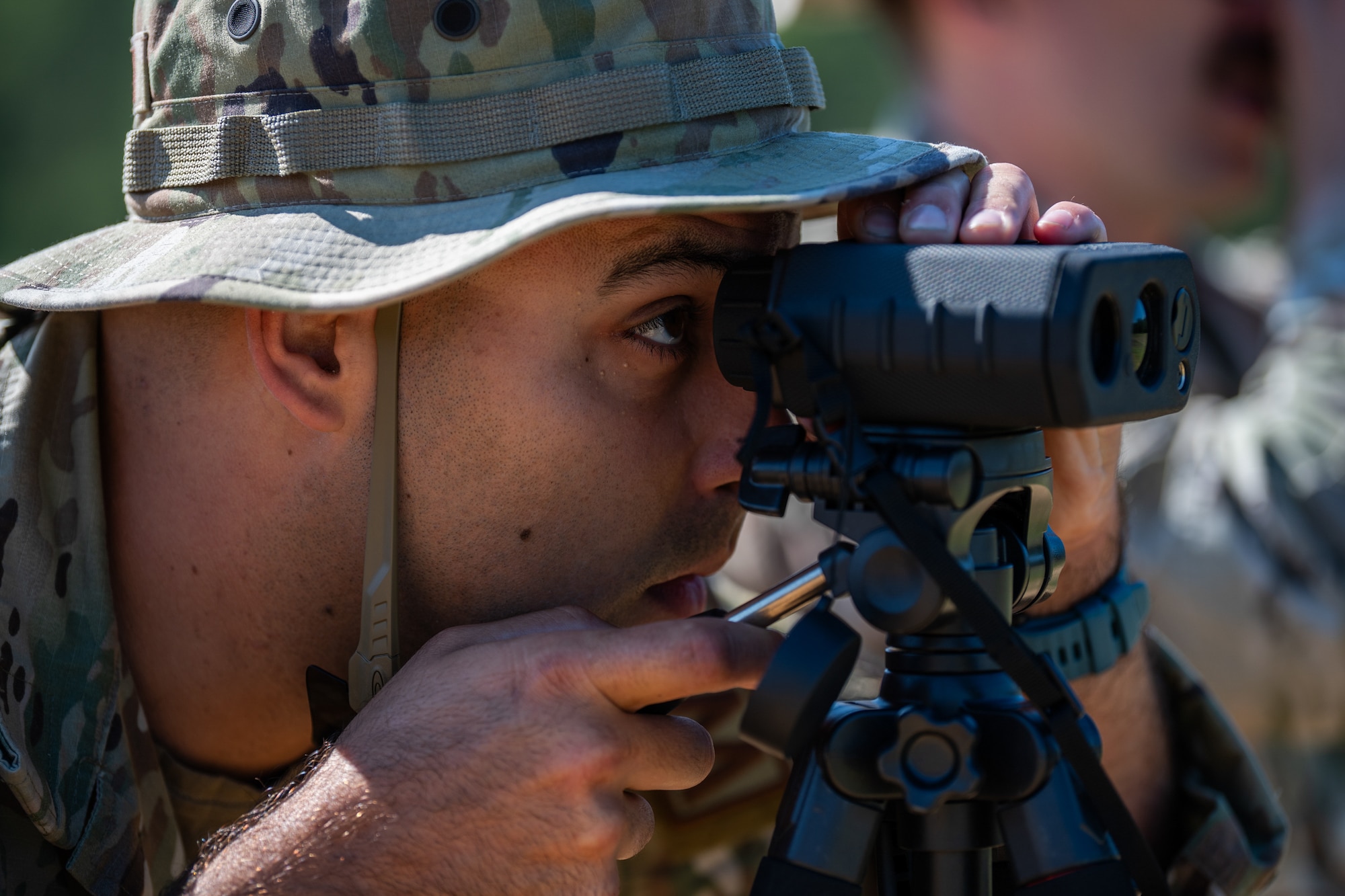 U.S. Air Force Master Sgt. Alexander Klosterman, a weather specialist assigned to the Kentucky Air National Guard’s 123rd Contingency Response Group, looks through a laser range finder at Young Tactical Landing site in Fort McCoy, Wis., Aug. 22, 2026, in support of exercise Patriot 26. The Air National Guard-hosted exercise brings together approximately 1,000 Airmen and Soldiers from National Guard units across 35 states, along with federal, state and local agencies, to enhance domestic response readiness and interagency coordination during large-scale emergencies. (U.S. Air National Guard photo by Senior Airman Angelee Barnett)