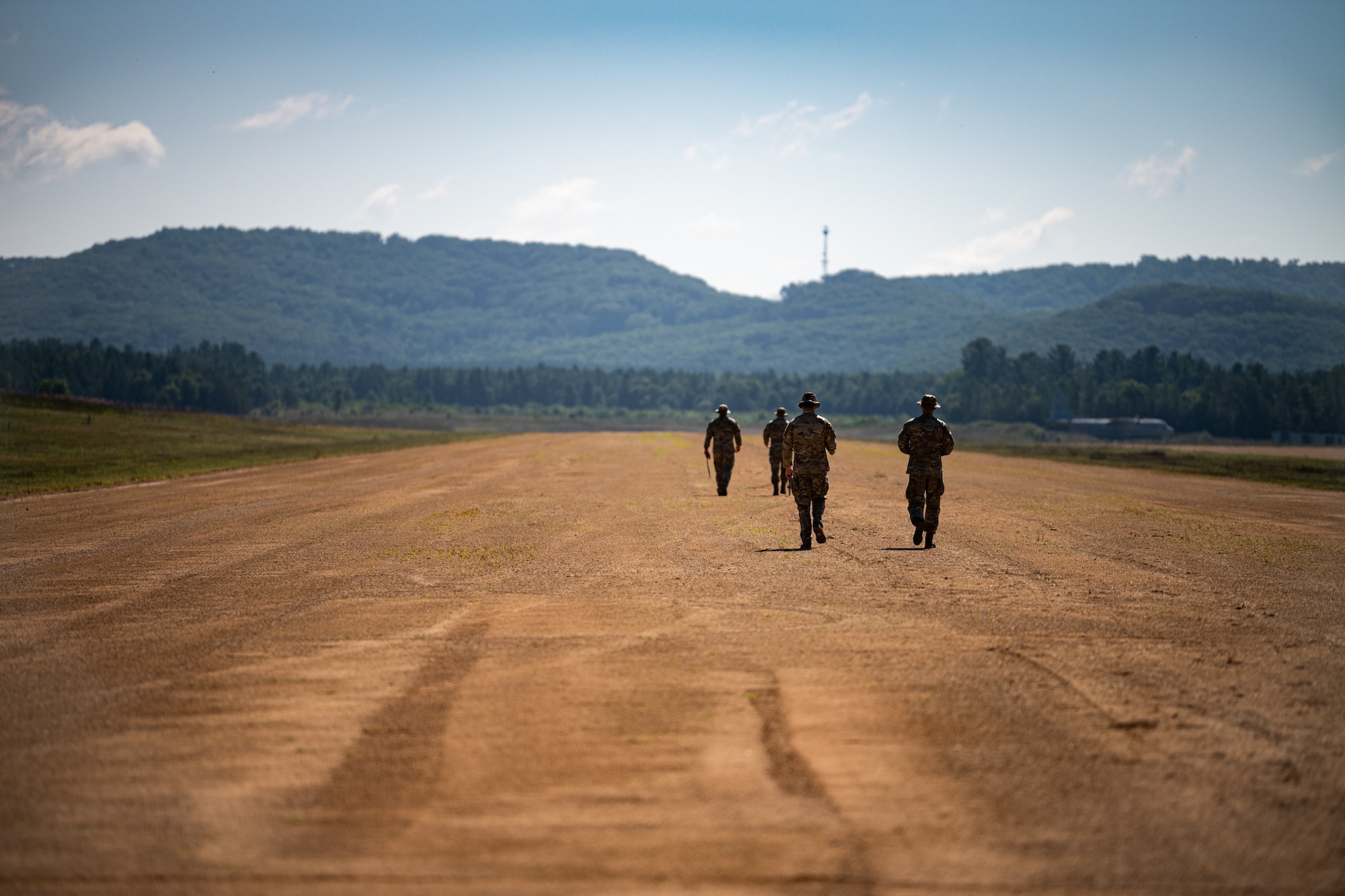 U.S. Air Force Airmen assigned to the Kentucky Air National Guard’s 123rd Contingency Response Group measure the runway at Young Tactical Landing Site in Fort McCoy, Wis., Aug. 22, 2026, during exercise Patriot 26. The Air National Guard-hosted exercise brings together approximately 1,000 Airmen and Soldiers from National Guard units across 35 states, along with federal, state and local agencies, to enhance domestic response readiness and interagency coordination during large-scale emergencies. (U.S. Air National Guard photo by Senior Airman Angelee Barnett)