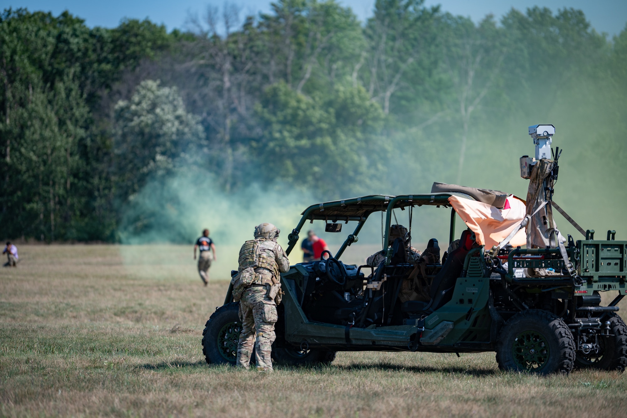 U.S. Air Force Security Forces specialists with the Kentucky Air National Guard’s 123rd Contingency Response Group fire blank ammunition at simulated opposing forces at Volk Field Combat Readiness Training Center, Wis., Aug. 26, 2026, during exercise Patriot 26. The Air National Guard-hosted exercise brings together approximately 1,000 Airmen and Soldiers from National Guard units across 35 states, along with federal, state and local agencies, to enhance domestic response readiness and interagency coordination during large-scale emergencies. (U.S. Air National Guard photo by Senior Airman Angelee Barnett)