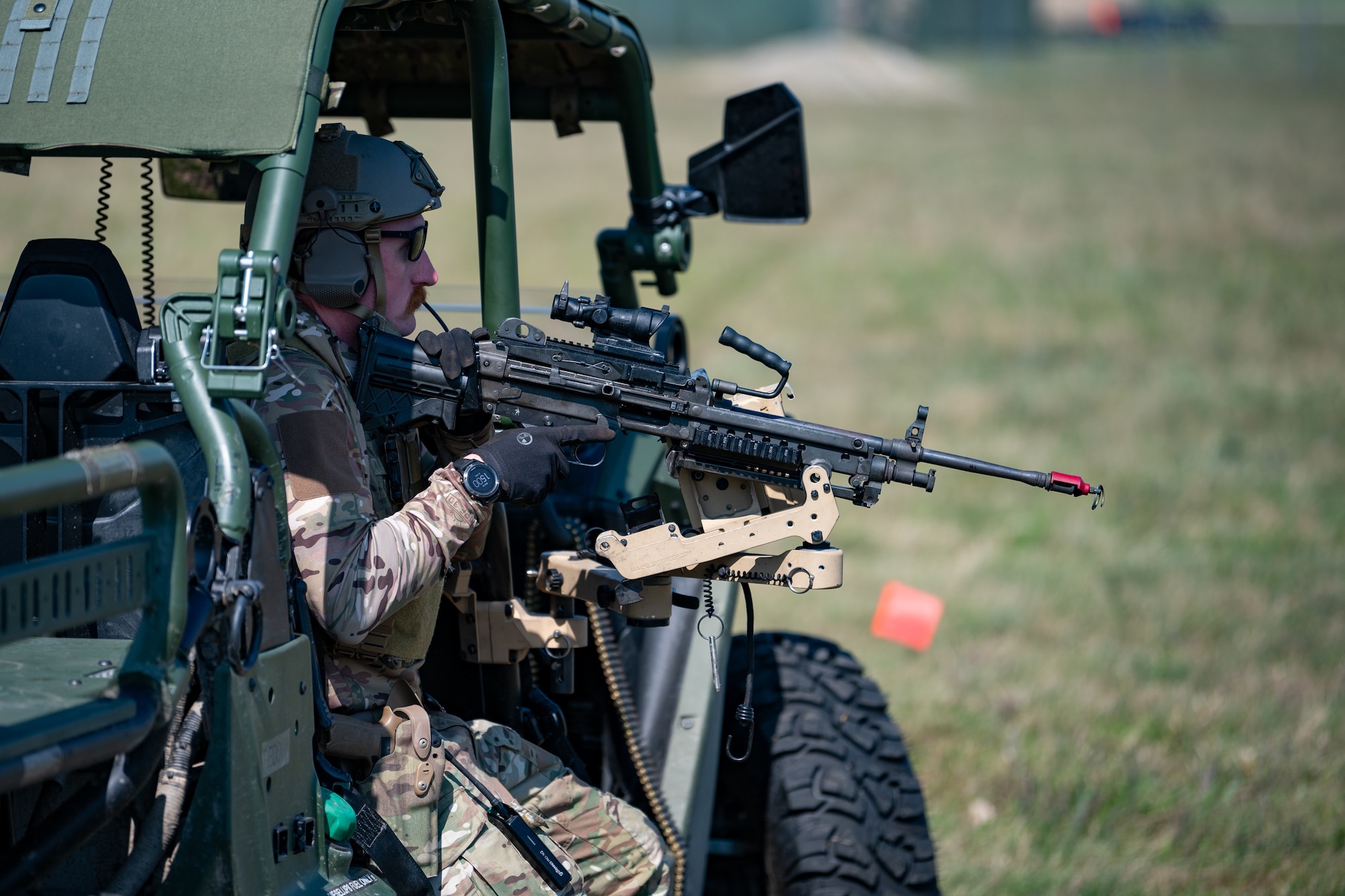 U.S. Air Force Staff Sgt. Tyler McCauley, a Security Forces specialist with the Kentucky Air National Guard’s 123rd Contingency Response Group, readies an M249 B squad automatic weapon at Volk Field Combat Readiness Training Center, Wis., Aug. 26, 2026, during exercise Patriot 26. The Air National Guard-hosted exercise brings together approximately 1,000 Airmen and Soldiers from National Guard units across 35 states, along with federal, state and local agencies, to enhance domestic response readiness and interagency coordination during large-scale emergencies. (U.S. Air National Guard photo by Senior Airman Angelee Barnett)