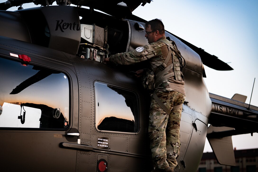 U.S. Army Sgt.1st Class Devin Gregory from the Kentucky Army National Guard’s Charlie Company, 1st Battalion, 376th Aviation Regiment, inspects a UH-72 Lakota prior to a night sortie at Volk Field Combat Readiness Training Center, Wis., Aug. 22, 2026, during exercise Patriot 26. The Air National Guard-hosted exercise brings together approximately 1,000 Airmen and Soldiers from National Guard units across 35 states, along with federal, state and local agencies, to enhance domestic response readiness and interagency coordination during large-scale emergencies. (U.S. Air National Guard photo by Senior Airman Angelee Barnett)