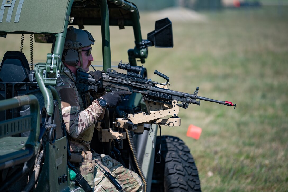 U.S. Air Force Staff Sgt. Tyler McCauley, a Security Forces specialist with the Kentucky Air National Guard’s 123rd Contingency Response Group, readies an M249 B squad automatic weapon at Volk Field Combat Readiness Training Center, Wis., Aug. 26, 2026, during exercise Patriot 26. The Air National Guard-hosted exercise brings together approximately 1,000 Airmen and Soldiers from National Guard units across 35 states, along with federal, state and local agencies, to enhance domestic response readiness and interagency coordination during large-scale emergencies. (U.S. Air National Guard photo by Senior Airman Angelee Barnett)