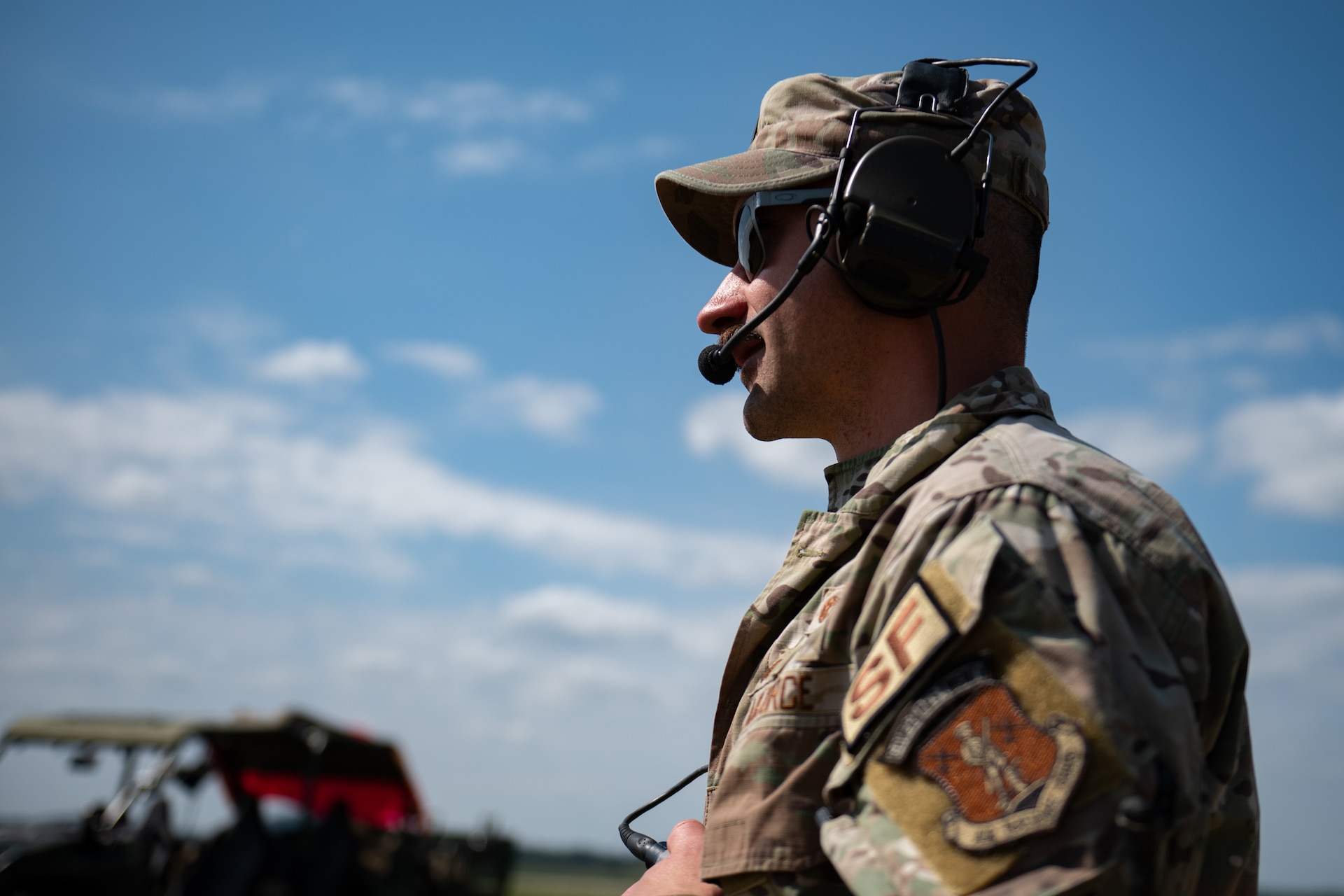 U.S. Air Force Capt. David Farc, a Security Forces base defense officer with the Kentucky Air National Guard’s 123rd Contingency Response Group, communicates simulated threats at Volk Field Combat Readiness Training Center, Wis., Aug. 25, 2026, during exercise Patriot 26. The Air National Guard-hosted exercise brings together approximately 1,000 Airmen and Soldiers from National Guard units across 35 states, along with federal, state and local agencies, to enhance domestic response readiness and interagency coordination during large-scale emergencies. (U.S. Air National Guard photo by Senior Airman Angelee Barnett)