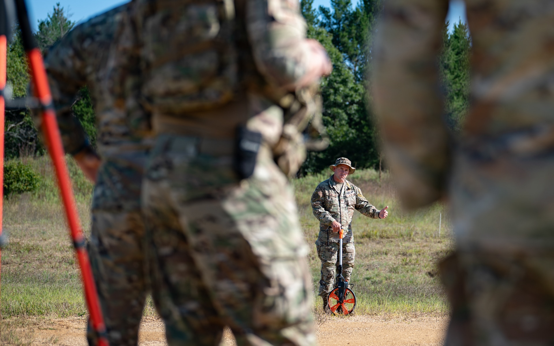 U.S. Air Force Master Sgt. Ryan Thompson, an airfield management specialist assigned to the Kentucky Air National Guard’s 123rd Contingency Response Group, trains Airmen on airfield safety inspections at Young Tactical Landing Site in Fort McCoy, Wis., Aug. 22, 2026, in support of exercise Patriot 26. The Air National Guard-hosted exercise brings together approximately 1,000 Airmen and Soldiers from National Guard units across 35 states, along with federal, state and local agencies, to enhance domestic response readiness and interagency coordination during large-scale emergencies. (U.S. Air National Guard photo by Senior Airman Angelee Barnett)