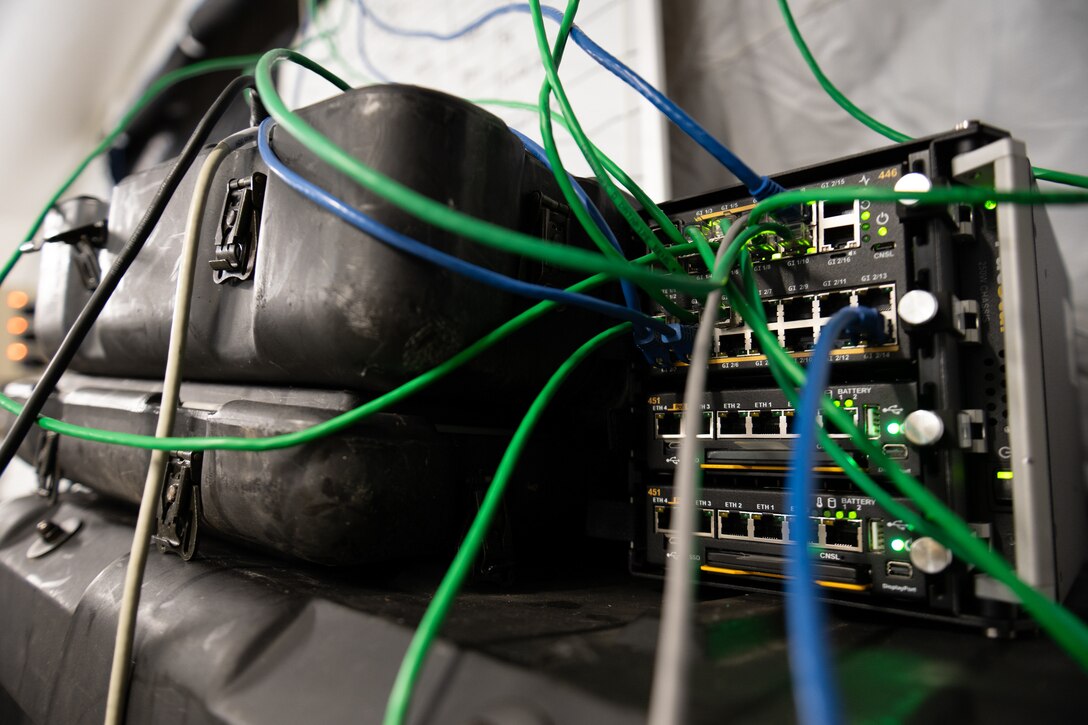 A network switch operated by the Kentucky Air National Guard’s 123rd Contingency Response Group provides troops with network access at a forward operating base at Volk Field Combat Readiness Training Center, Wis., Aug. 26, 2026, during exercise Patriot 26. The Air National Guard-hosted exercise brings together approximately 1,000 Airmen and Soldiers from National Guard units across 35 states, along with federal, state and local agencies, to enhance domestic response readiness and interagency coordination during large-scale emergencies. (U.S. Air National Guard photo by Senior Airman Angelee Barnett)