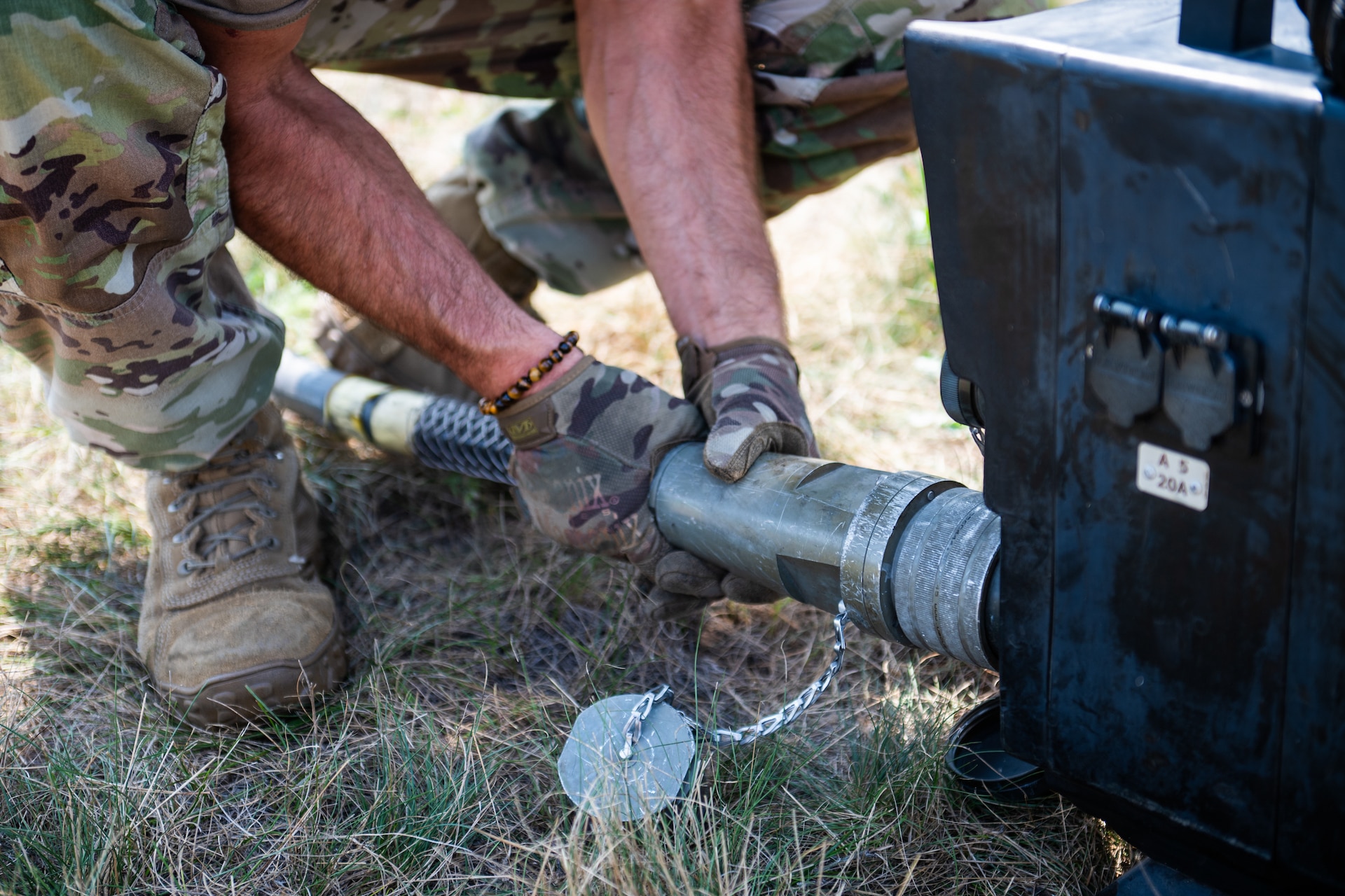 A U.S. Air Force Airman from the Kentucky Air National Guard’s 123rd Contingency Response Group connects a cable to a generator during camp setup for exercise Patriot 2026 at Volk Field Combat Readiness Training Center, Wis., Aug. 20, 2026. Patriot 26, an Air National Guard-hosted exercise brings together approximately 1,000 Airmen and Soldiers from National Guard units across 35 states, along with federal, state and local agencies, to enhance domestic response readiness and interagency coordination during large-scale emergencies. (U.S. Air National Guard photo by Senior Airman Angelee Barnett)