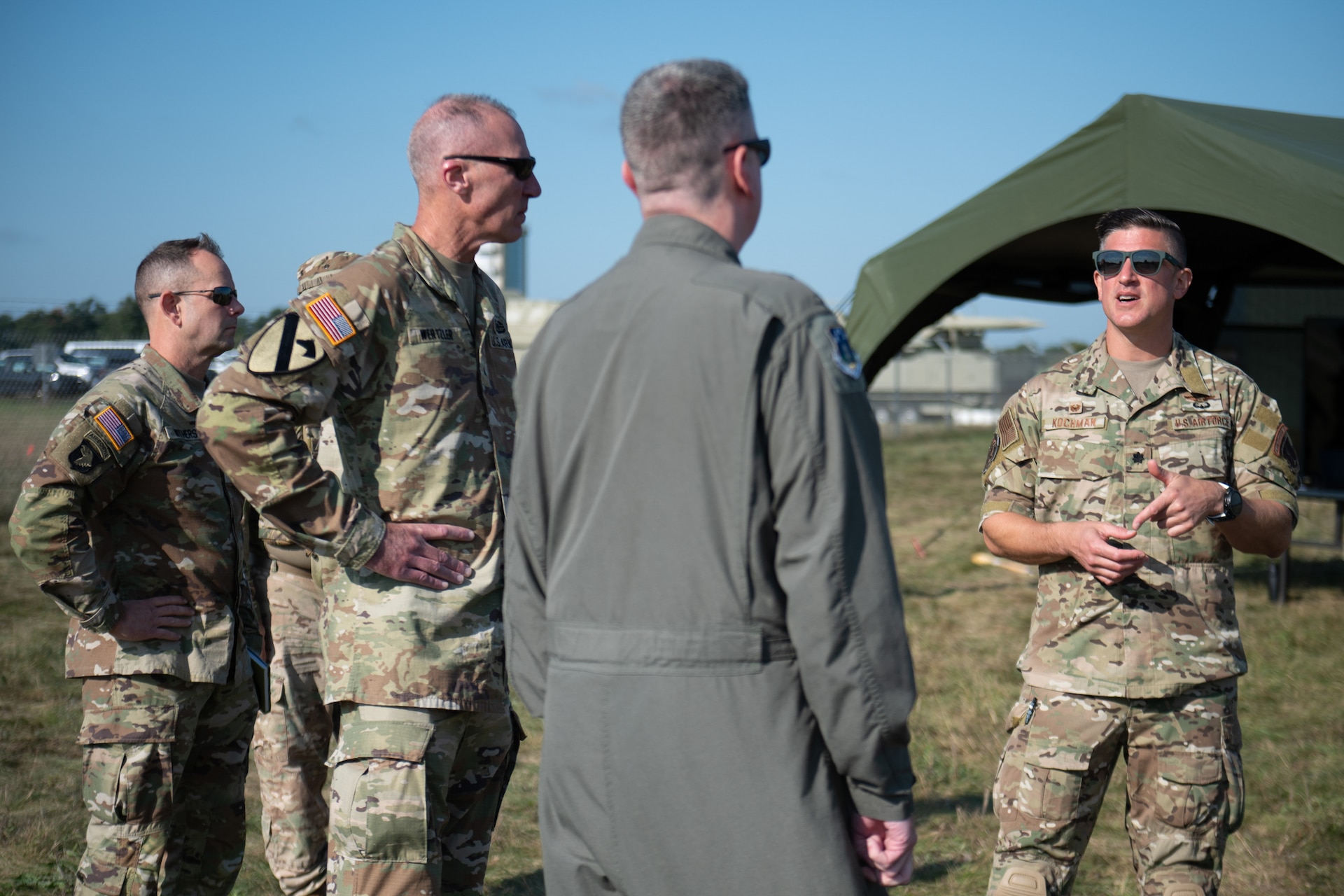 U.S. Air Force Lt. Col. Andrew Kochman, right, commander of the Kentucky Air National Guard’s 123rd Contingency Response Support Squadron Commander, speaks with senior leadership from the Kentucky National Guard at Volk Field Combat Readiness Training Center, Wis., Aug. 24, 2026, during exercise Patriot 26. The Air National Guard-hosted exercise brings together approximately 1,000 Airmen and Soldiers from National Guard units across 35 states, along with federal, state and local agencies, to enhance domestic response readiness and interagency coordination during large-scale emergencies. (U.S. Air National Guard photo by Senior Airman Angelee Barnett)