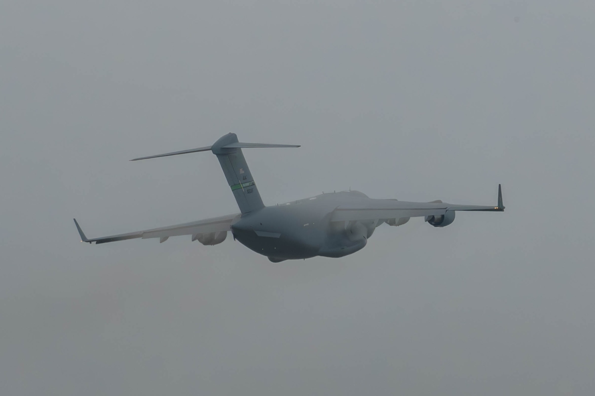 A plane flies through clouds.