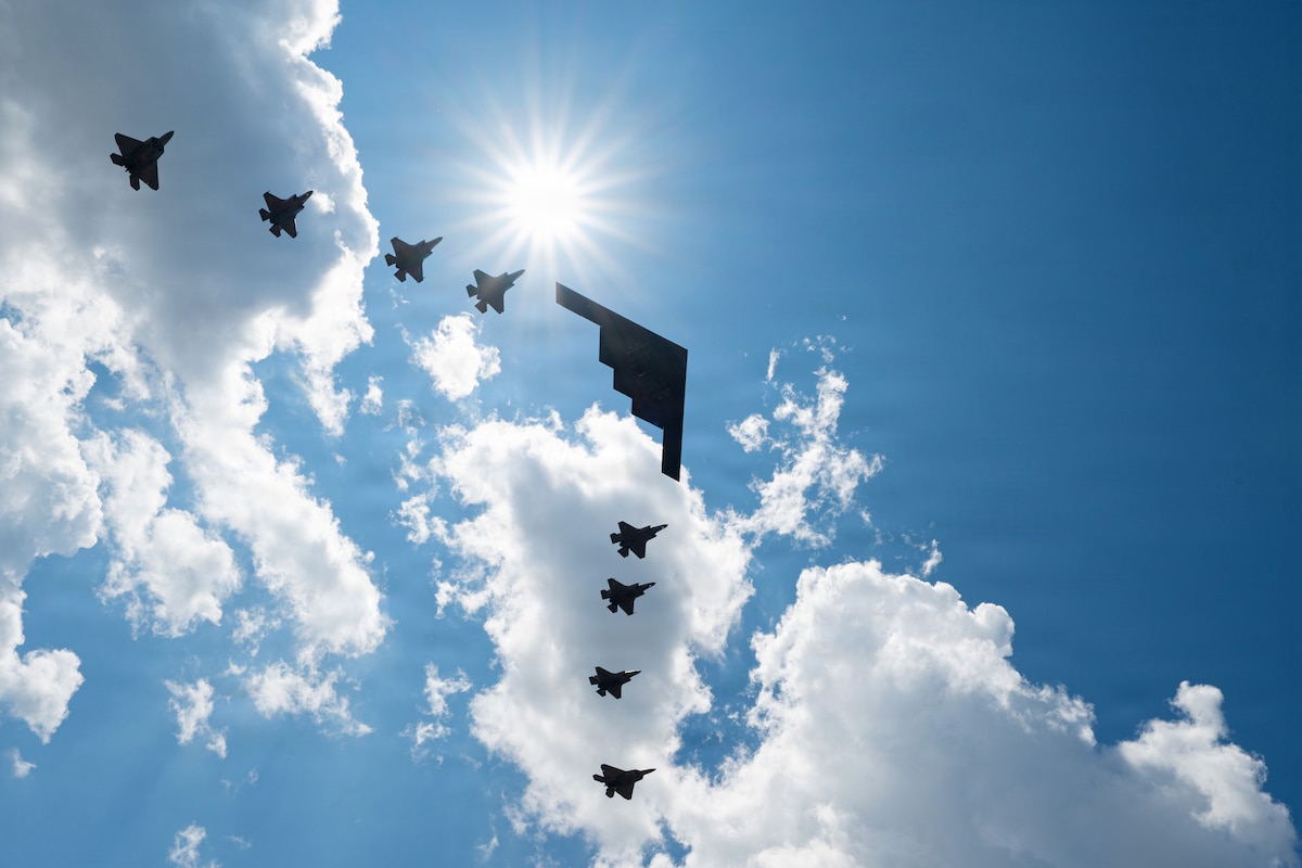 A B-2 Spirit, two F-35A Lightning IIs, two F-22 Raptors and four U.S. Marine Corps F-35B Lightning IIs fly over the IndyCar Freedom 250 Grand Prix in Washington, D.C., Aug. 22, 2026. The historic aerial demonstration over the National Mall celebrated the 250th anniversary of the United States while highlighting joint air dominance. (U.S. Air Force photo by Senior Airman Joseph Garcia)